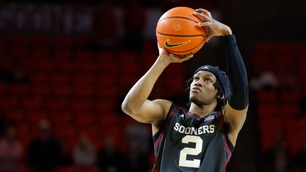 Oklahoma Sooners guard Javian McCollum (2) makes a 3-pointer during a college basketball game between the University of Oklahoma Sooners (OU) and the West Virginia Mountaineers at Lloyd Noble Center in Norman, Okla., Okla., Wednesday, Jan. 17, 2024.